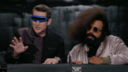 Comedy Bang! Bang! Season 5 Episode 19 - Reggie Watts Wears a Purple and Yellow Quilted Sweatshirt