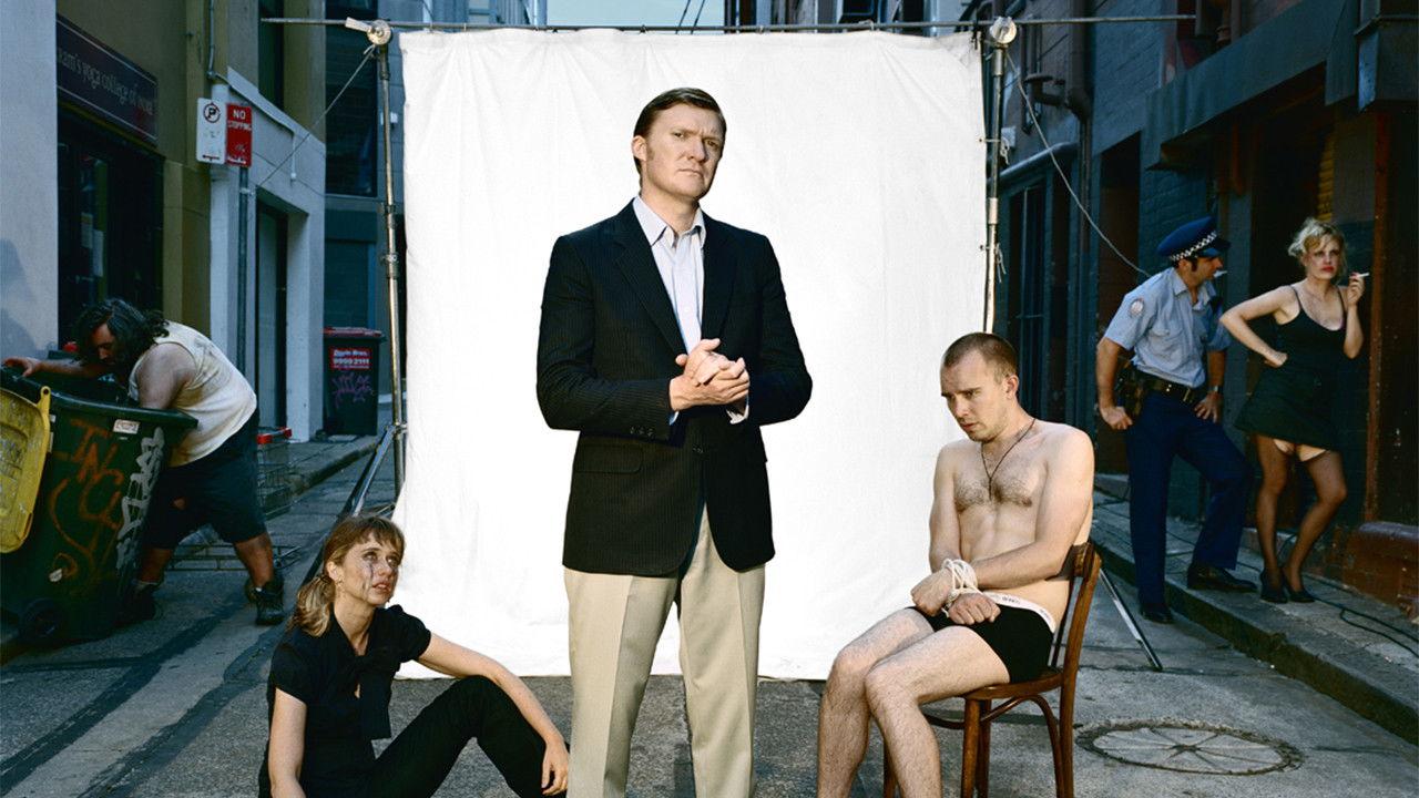 Review with Myles Barlow backdrop